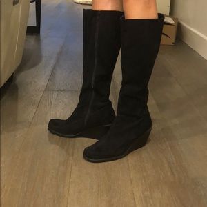 Black suede below the knee boots.